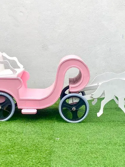 A side profile of our kids' entry carriage, showcasing its charming design. It's a favorite for princess parties and fairytale-themed events.