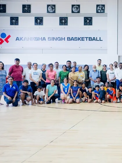 A group photo with players and parents at the conclusion of a summer camp session. We are proud of the strong community we have built, where families are an integral part of our journey.