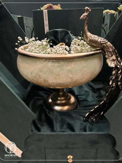 My signature Peacock Bowl, presented in a luxurious deep green velvet box. The contrast of the antique-finished brass peacock against the rich fabric makes for a stunning reveal.