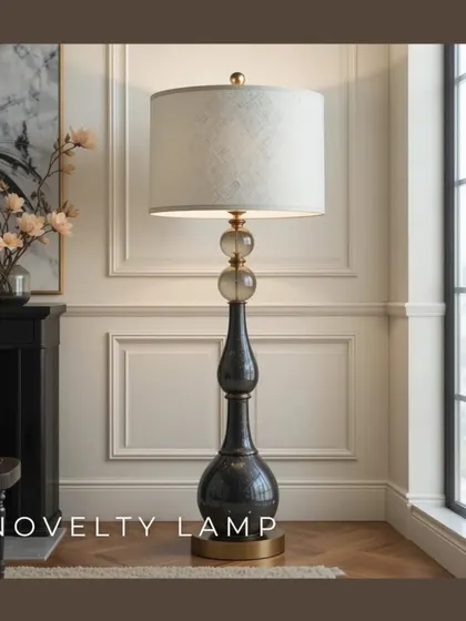 A novelty lamp can serve as a unique piece of decor that adds personality to a room. This elegant floor lamp, with its sculptural base and classic shade, acts as both a light source and a sophisticated accent piece.