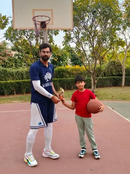 Presenting an award to a player for his outstanding skill development.