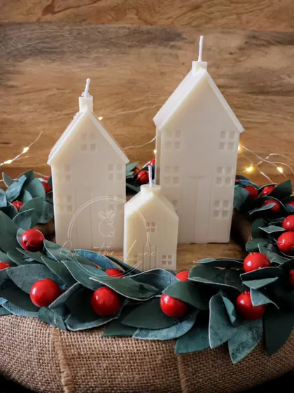 My Christmas village house candles. I make them in three different sizes so you can create your own little glowing village.