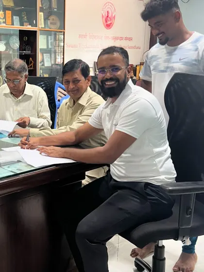 The process of signing the MOU, a collaborative effort to bring authentic aerial yoga training to a wider audience under the esteemed banner of S-VYASA.