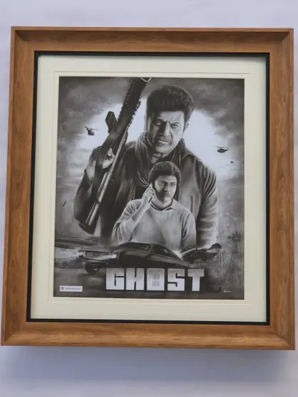 Beyond traditional portraits, I also love taking on creative challenges. This is a custom charcoal drawing inspired by the poster for the movie 'Ghost', a tribute to the actor Shivarajkumar. It took nearly 50 hours to complete this A1 size artwork.