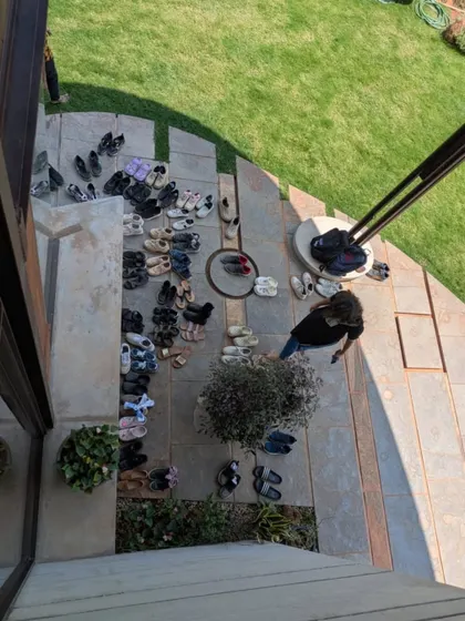 An overhead view of the entrance, marked by the shoes of dozens of students. To me, this image is a beautiful symbol of a space truly being inhabited and experienced, a place of shared learning and discovery.
