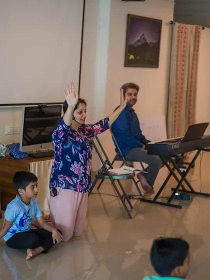 Here, the workshop transforms into an impromptu singing session. The joy in the room is palpable as children express themselves freely, reminding us that mindfulness can be found in laughter and song.