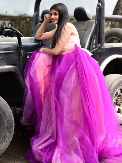 Our off-shoulder pink and purple gown looks great in photoshoots, adding a fun and vibrant element.