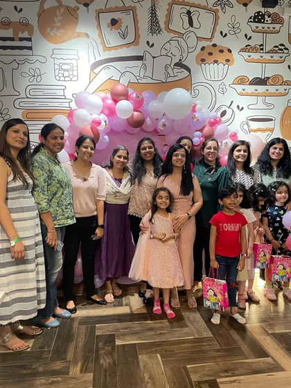 A big group photo of all the moms and kids at a birthday party. We love hosting large gatherings where friends and families can all celebrate together in one place.