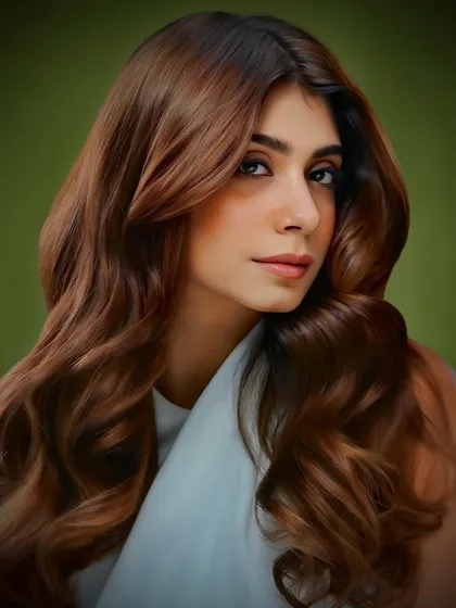 This look from our collection features soft, flowing waves with a warm brown tone that complements the client's skin tone beautifully.
