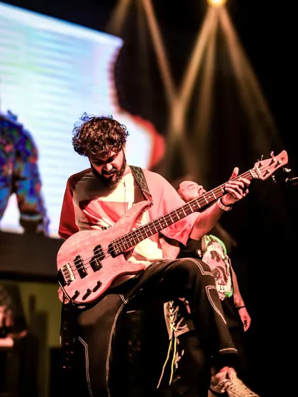 A close-up shot of our bassist, showcasing the intricate playing that gets the crowd moving.