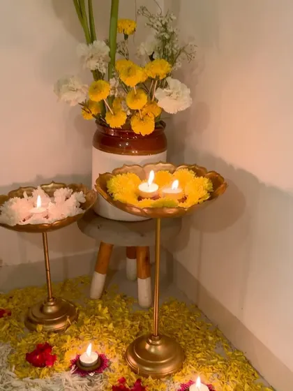 A simple yet beautiful Diwali corner, with floating candles in brass urlis and a bed of flower petals.