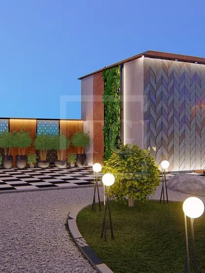 This render shows a unique feature wall with a wave-like pattern, a vertical garden, and a gravel pathway in the Gurgaon project.