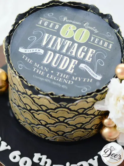 The edible printed topper adds a personalized and humorous touch to this milestone birthday cake.