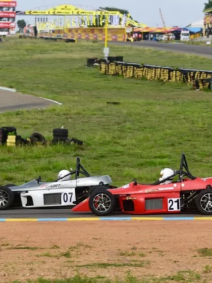 A duplicate image of the on-track battle, reinforcing the theme of intense competition.