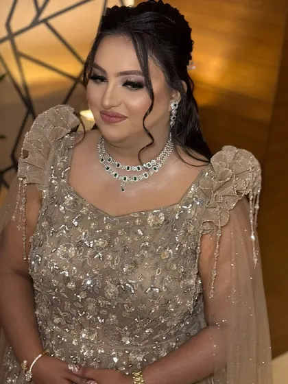 A candid moment capturing her radiant smile. The makeup is designed to look just as beautiful in motion and in candid photos as it does in posed portraits.