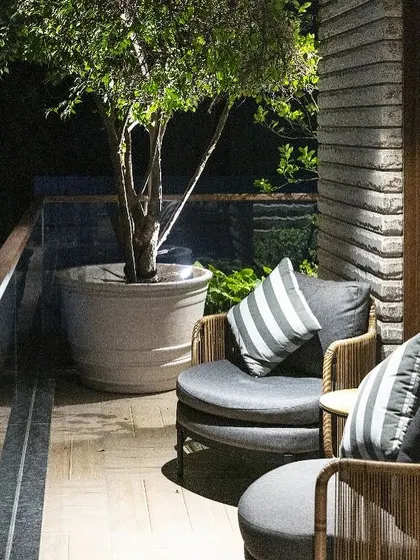 A quiet evening on the balcony of the Barkat residence. We design these outdoor spaces as true extensions of the home, with comfortable seating and thoughtful planting that create a serene atmosphere for relaxation.