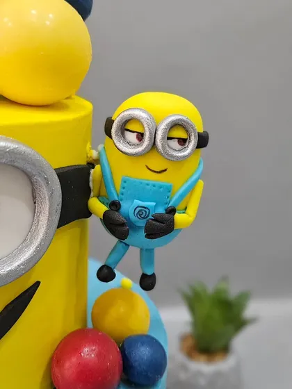 This cheeky Minion seems to be climbing up the cake tier, adding a fun, dynamic element to the design.