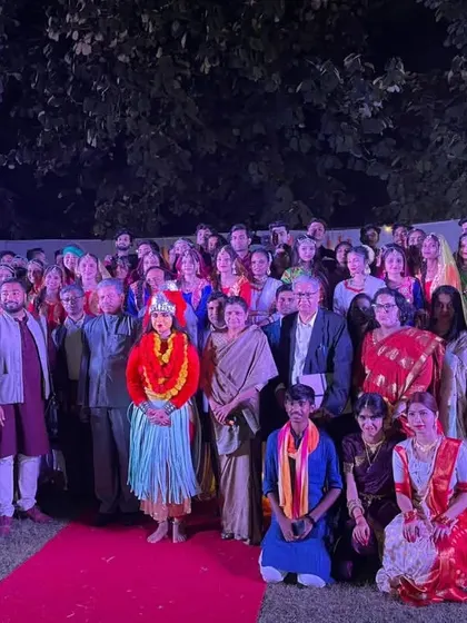 A group photo with performers and dignitaries at a cultural event. My choreography services extend to formal events that require polished and culturally rich performances.