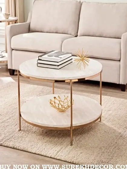 This elegant round center table features a two-tiered design with a beautiful rose gold finish. The white marble-like surfaces provide ample space for books and decor, making it a stylish and functional addition to any living room.