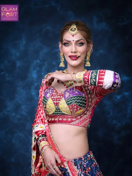 A powerful pose showcasing the full Navratri ensemble. The makeup is bold and expressive, just like the festival itself.