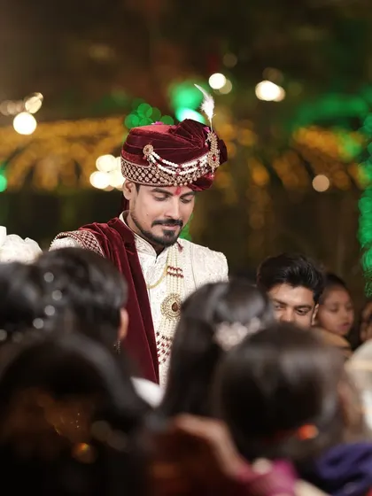 The groom making his way through the crowd, a candid moment filled with energy and anticipation.