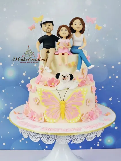 A studio shot of the custom family-themed cake we designed for Soha Ali Khan's birthday. Her daughter Inaaya requested a cake with edible figurines of the whole family, including their dog, Oreo!