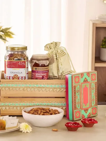 A health-conscious festive option, this crate contains a jar of granola, wild forest honey, almonds, and traditional sweets, offering a balanced mix of wholesome and indulgent treats.