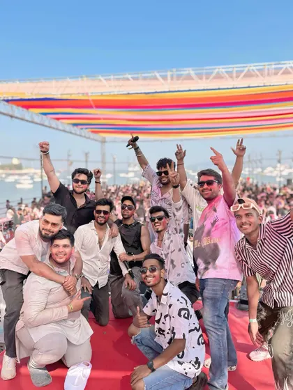 A group photo with the team and artists after a successful Holi event. It's a team effort to create such a great vibe.