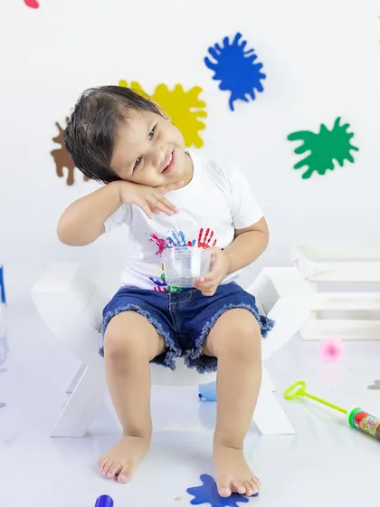 A playful and mischievous look. The Holi sessions are all about capturing candid expressions and the pure joy of playing with colors.