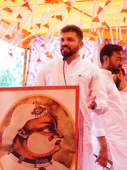 Addressing the gathering at the International Jat Divas, speaking about the contributions of the community and the challenges facing today's youth.