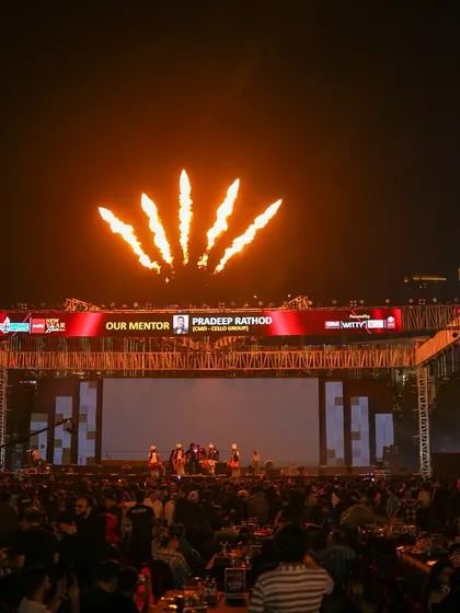 Pyrotechnics launch from the stage truss during a performance at the New Year celebration. We integrate special effects like these directly into the stage design for maximum impact.