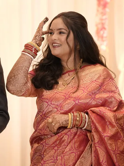 A candid shot of the bride during her reception.