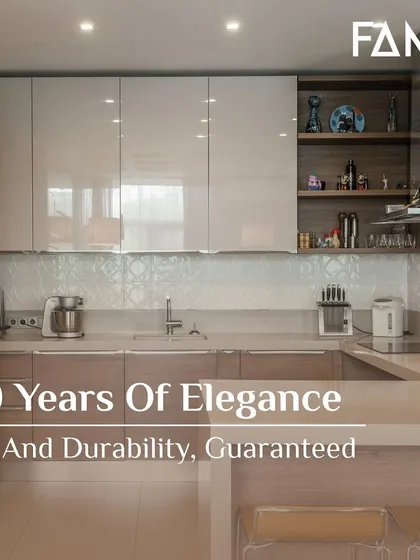 I guarantee 10 years of elegance and durability. This kitchen, with its high-gloss beige cabinets and wood accents, is a perfect example of a design that will remain stunning and strong over time.