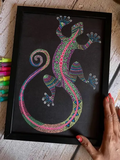 This colorful lizard, created with the dot art stippling technique, brings a playful and vibrant energy. The bright colors on the black background make the design pop.