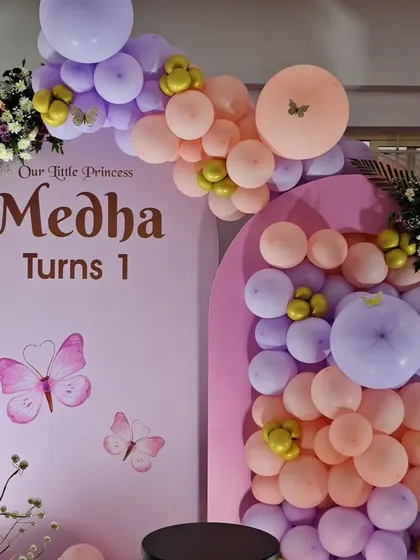 A close-up of the personalized backdrop for Medha's 'Our Little Princess' first birthday.