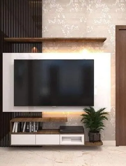 This compact TV unit is ideal for a bedroom or a small nook. The floating design and simple shelving provide essential storage without overwhelming the space.