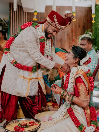 A happy and candid interaction between the bride and groom during their wedding ceremony.