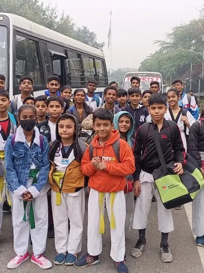 Team ASHA arriving by bus for the Open National Taekwondo Championship at Talkatora Indoor Stadium.