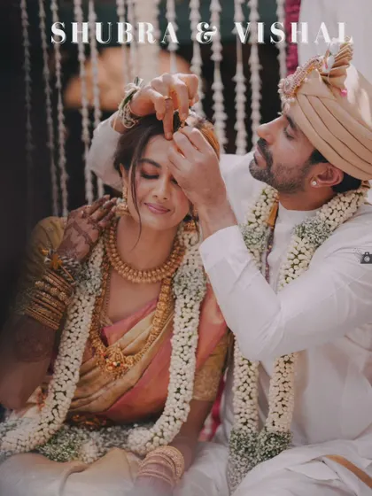 A stunning shot of Shubra and Vishal during their ceremony, capturing the moment the groom applies sindoor. The text overlay emphasizes the storytelling aspect.
