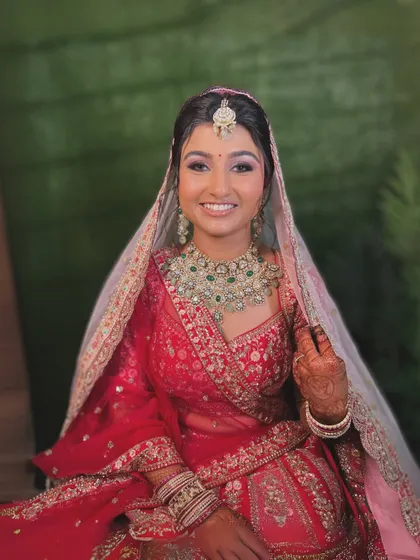 A candid shot showing the bride's radiant smile. The makeup is designed to look natural and feel comfortable throughout the day.