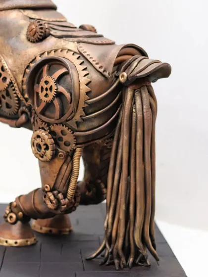 The rear view of the sculpted horse, highlighting the tail made of individual fondant strands and the complex gear systems on the hindquarters.