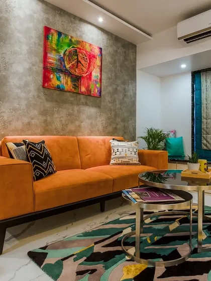 Another view of the colorful living room, showing the bay window seating area, which provides extra seating and a cozy spot to relax.