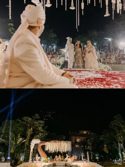 A wide view of a night wedding ceremony, showcasing the grand scale of the mandap against the natural landscape. The lighting is designed to make the structure glow, creating a beacon of celebration.