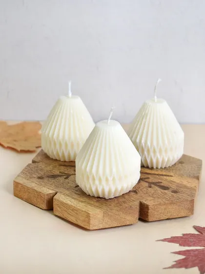 Illuminate your space with our festive geometric candles. They look great on their own or grouped together.