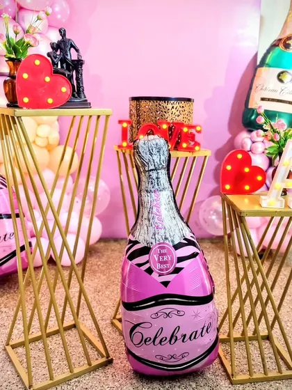A detail shot of the props used in the bridal shower decor. I used themed elements like "Celebrate" champagne balloons and light-up hearts to add personality and fun to the setup.