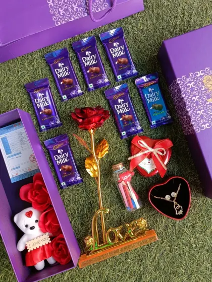 The complete Valentine's Day combo, beautifully arranged. It also includes a small teddy bear and comes in a lovely purple gift box.