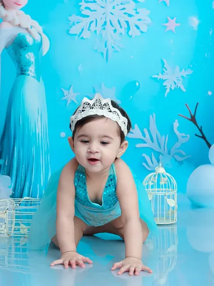 Crawling through the snow. This action shot captures the playful side of our little snow queen as she explores the wintery landscape with Olaf.
