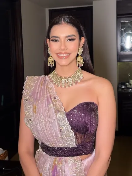 A happy, smiling portrait from the welcome dinner. The rhinestone and silver eye makeup is glamorous, but the overall feel is still soft and romantic.