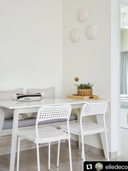 Another shot from the Elle Decor feature, showing the cozy dining nook. The design proves that even small spaces can be highly functional and stylish with the right approach.