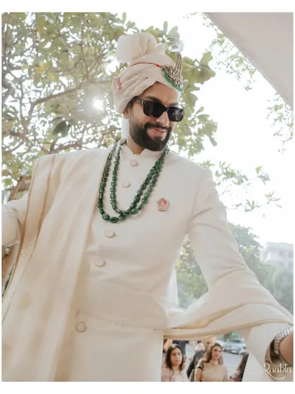 The groom, Siddhant, looking dapper and cool in sunglasses, captured in a candid moment during the baraat.